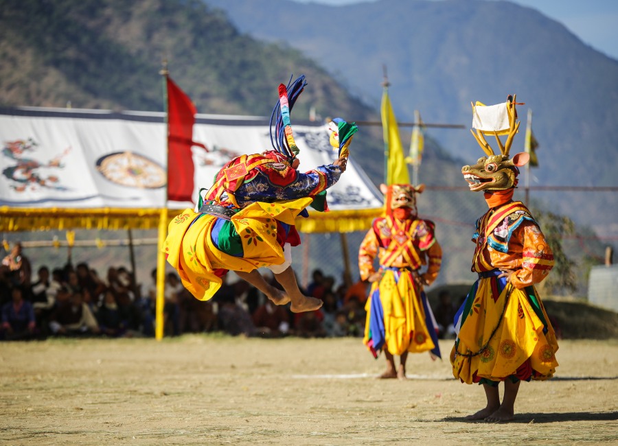 Masked dancer jumping