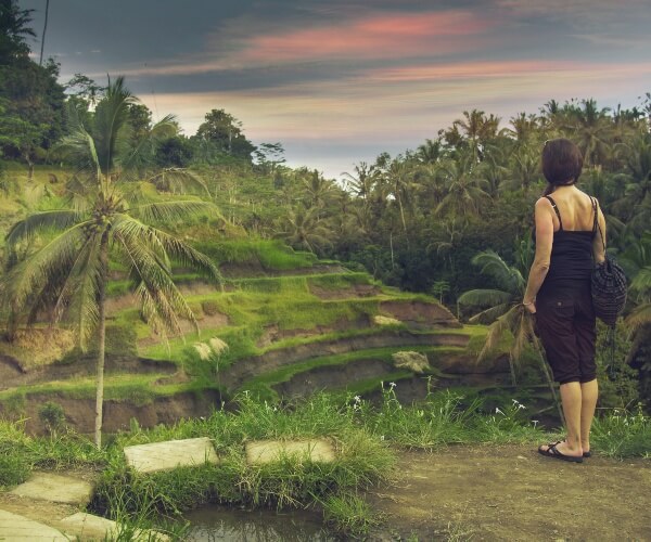 Tourist looking over rice fields Ubud