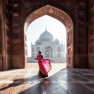 Woman in red sareesari, Taj Mahal, India